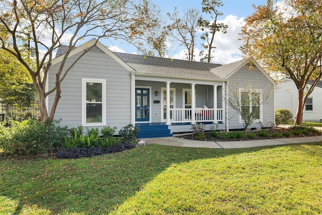 view of front of house featuring a porch and a front yard