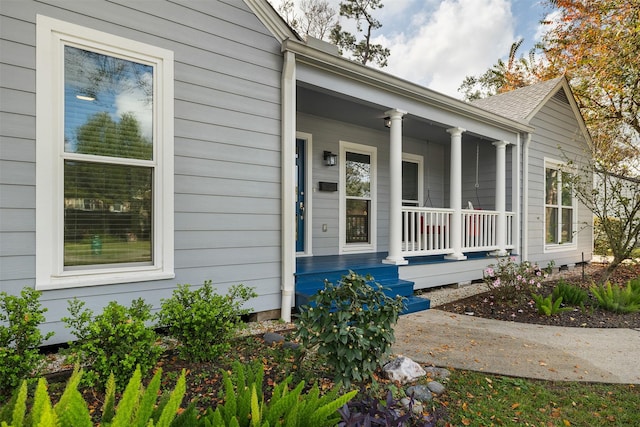 doorway to property featuring covered porch