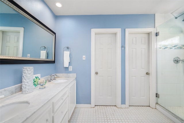 bathroom featuring vanity and an enclosed shower