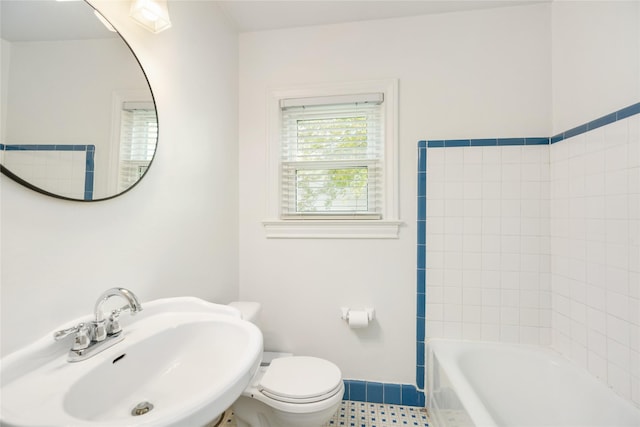 bathroom with tile patterned flooring, toilet, and sink