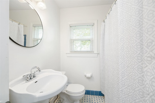 bathroom with toilet and sink