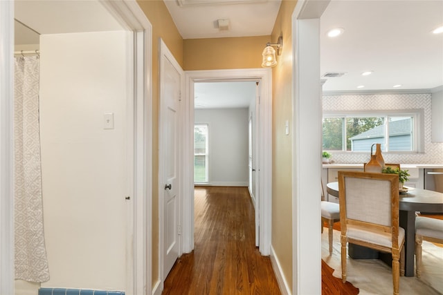 hallway with dark wood-type flooring