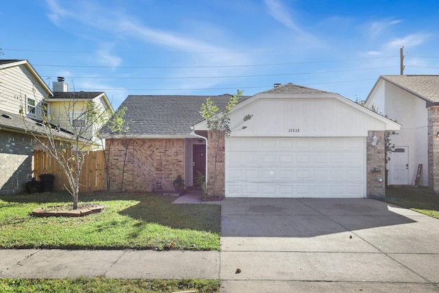 ranch-style home with a garage and a front yard