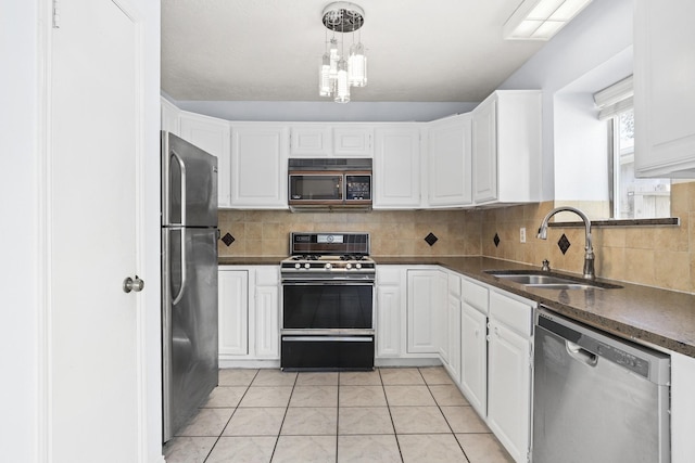 kitchen featuring black appliances, white cabinets, and sink