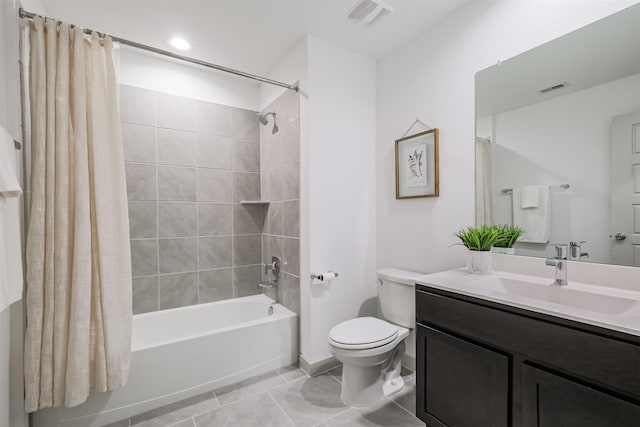 full bathroom with tile patterned floors, vanity, toilet, and shower / tub combo with curtain