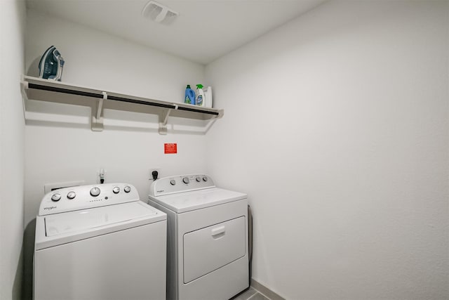 laundry room with washer and dryer