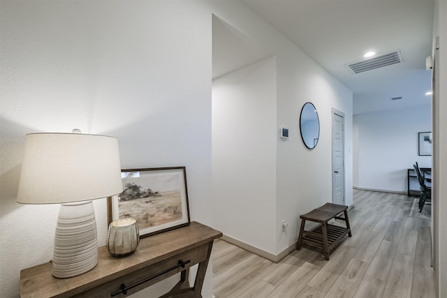 corridor with light wood-type flooring