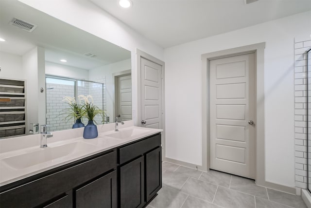 bathroom featuring tile patterned floors, vanity, and walk in shower