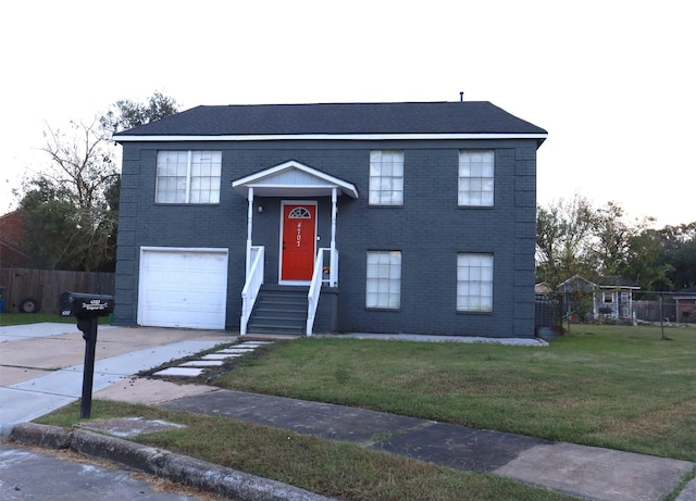 raised ranch with an attached garage, brick siding, fence, concrete driveway, and a front lawn