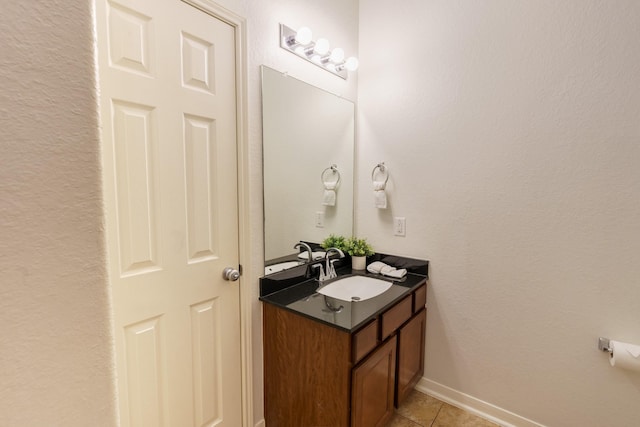 bathroom featuring tile patterned flooring and vanity