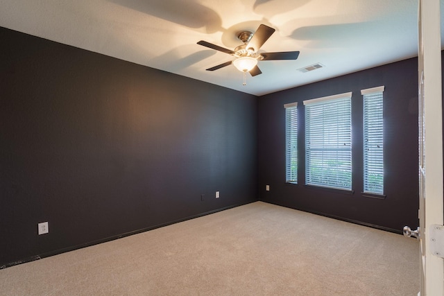 carpeted empty room with ceiling fan