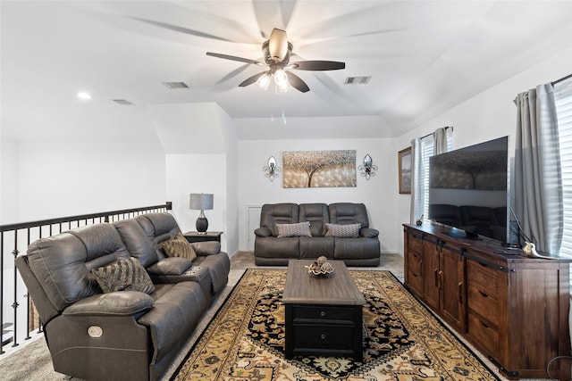 carpeted living room featuring ceiling fan