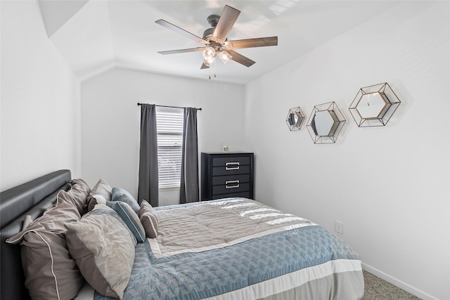 carpeted bedroom with ceiling fan and lofted ceiling