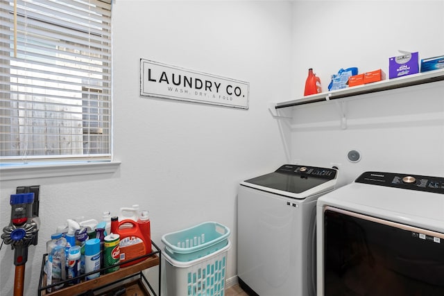 washroom with independent washer and dryer