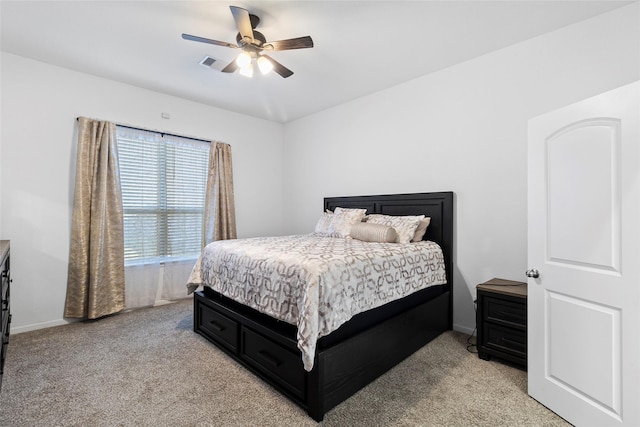 bedroom featuring ceiling fan and light colored carpet