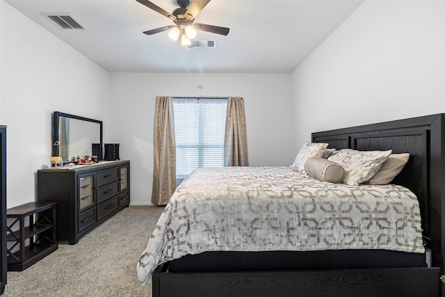 bedroom with ceiling fan and light colored carpet