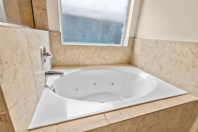 bathroom featuring tiled tub