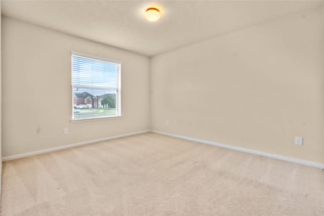 empty room featuring light colored carpet