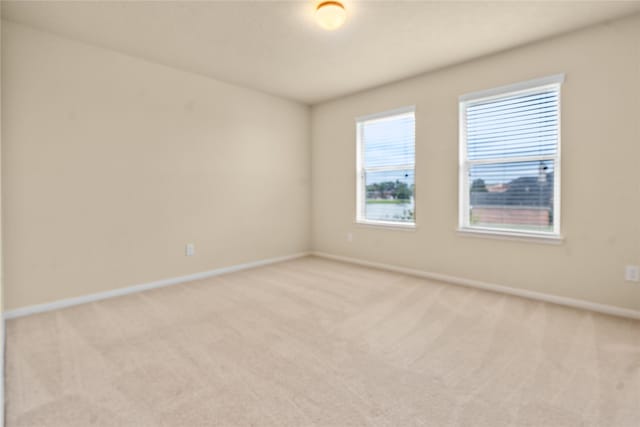 empty room featuring light carpet