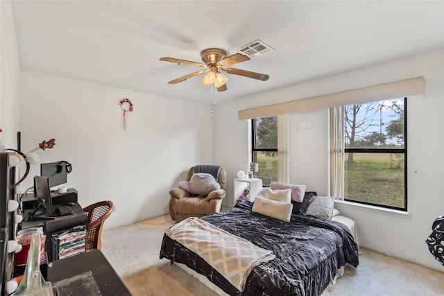 bedroom featuring ceiling fan and light colored carpet