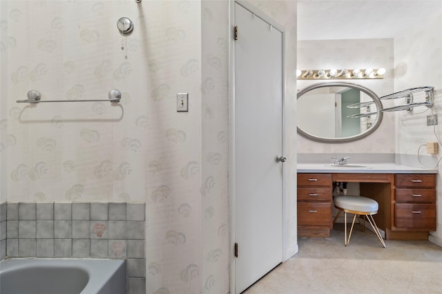 bathroom featuring vanity and a tub to relax in