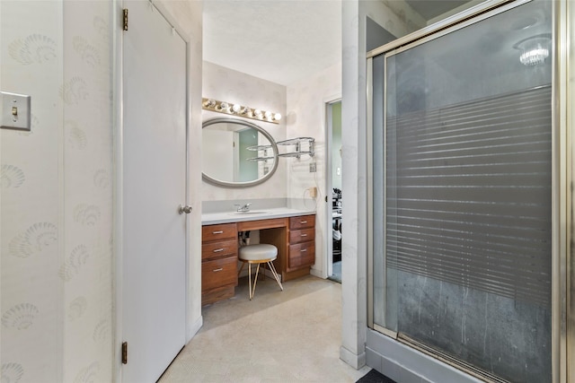 bathroom featuring vanity and a shower with shower door