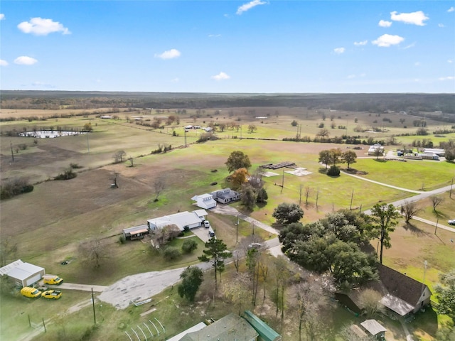 birds eye view of property with a rural view