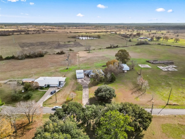 birds eye view of property with a rural view