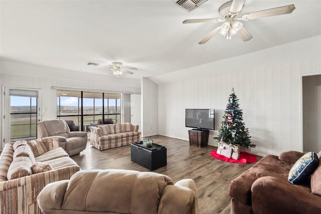 living room with ceiling fan and hardwood / wood-style flooring