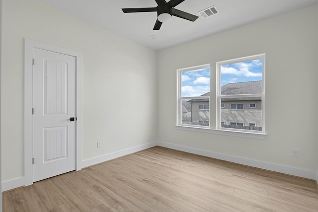 unfurnished room featuring ceiling fan and light hardwood / wood-style floors