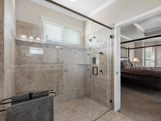 bathroom featuring tile patterned floors, a shower with door, and crown molding