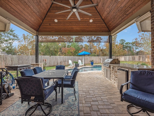 view of patio / terrace featuring area for grilling, a gazebo, an outdoor kitchen, and ceiling fan