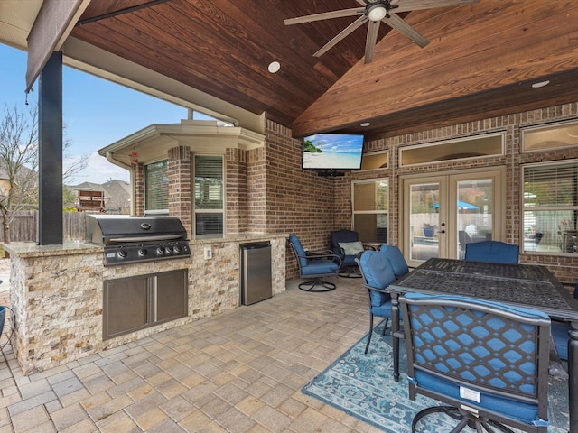 view of patio / terrace with ceiling fan, french doors, an outdoor kitchen, and grilling area