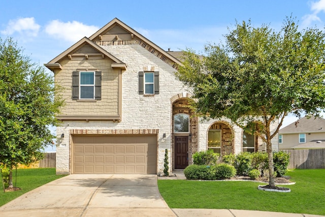 view of front facade featuring a garage and a front lawn