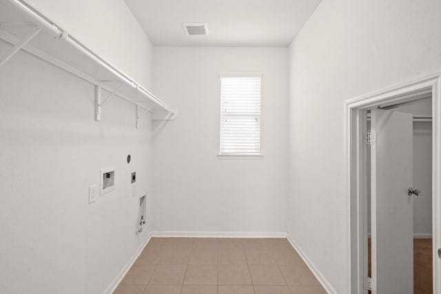 laundry room featuring hookup for a washing machine, hookup for a gas dryer, light tile patterned floors, and electric dryer hookup