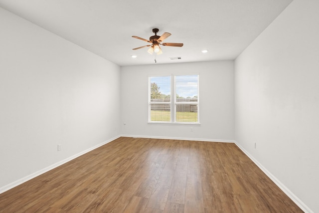 spare room featuring ceiling fan and wood-type flooring