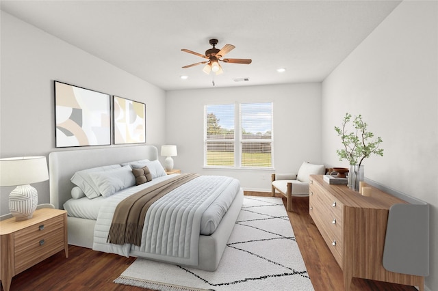 bedroom featuring ceiling fan and dark wood-type flooring