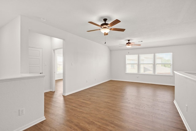 empty room featuring ceiling fan and dark hardwood / wood-style floors