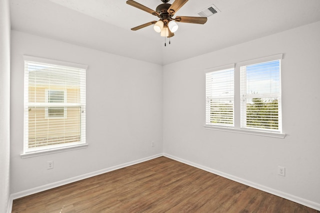 unfurnished room with ceiling fan and wood-type flooring