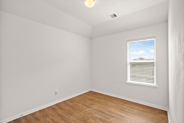 spare room featuring hardwood / wood-style flooring