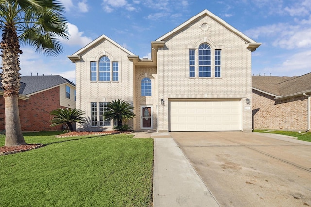 view of property with a front yard and a garage