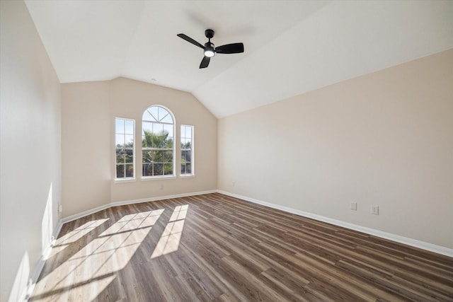 empty room featuring wood-type flooring, ceiling fan, and lofted ceiling