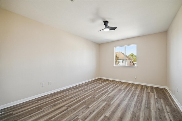 empty room with hardwood / wood-style floors