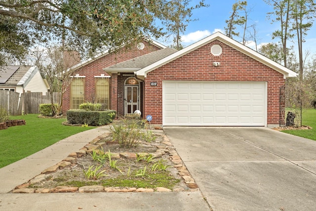 view of front facade with a garage and a front lawn