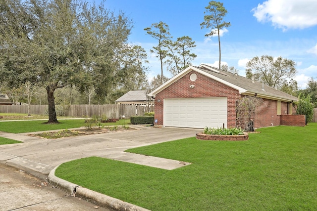 view of side of property with fence, a yard, an attached garage, and brick siding