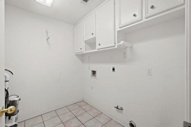 washroom featuring hookup for an electric dryer, washer hookup, hookup for a gas dryer, baseboards, and cabinet space