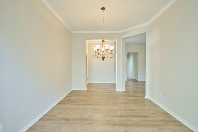 unfurnished dining area with light hardwood / wood-style flooring, crown molding, and a chandelier