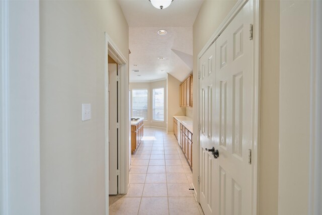 hallway with light tile patterned floors