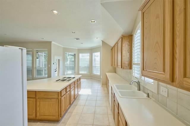 kitchen featuring sink, white appliances, light tile patterned floors, tasteful backsplash, and crown molding