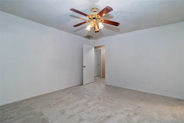 unfurnished room featuring light carpet and ceiling fan